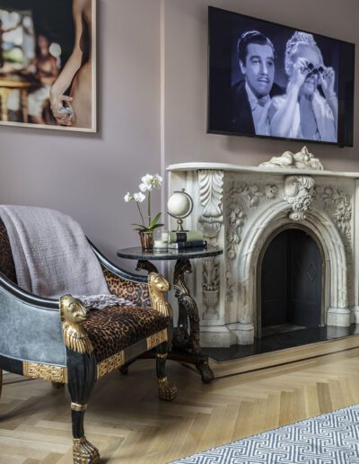 A living room with a fireplace and a tv.