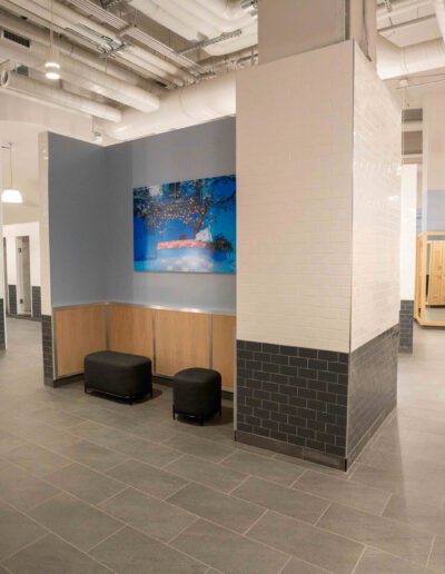 A locker room with a painting on the wall.