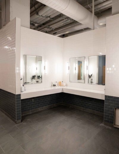 A bathroom with two sinks and mirrors.