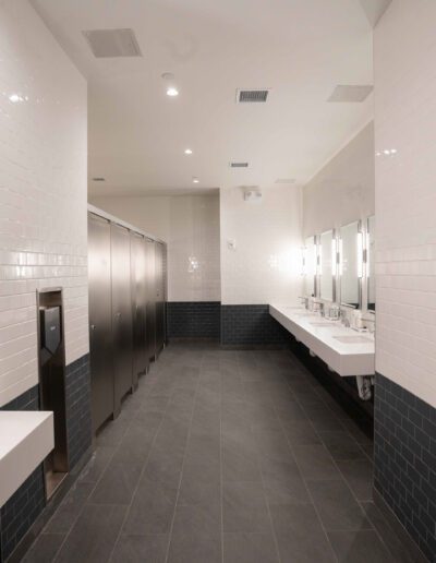 A bathroom with two sinks and a mirror.