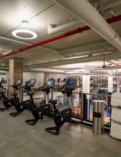 A gym with a lot of exercise equipment.