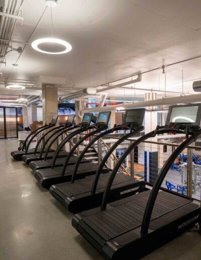 A gym with treadmills and other exercise equipment.