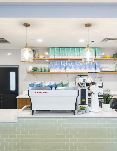 A coffee shop with a green tiled counter.