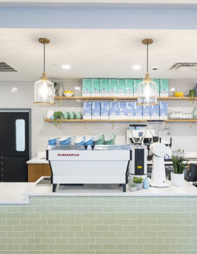 A coffee shop with a green tiled counter.