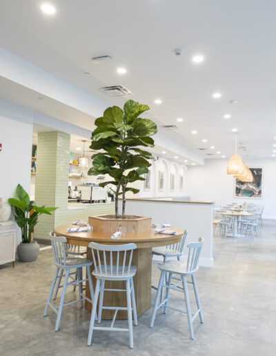 The interior of a restaurant with a table and chairs.